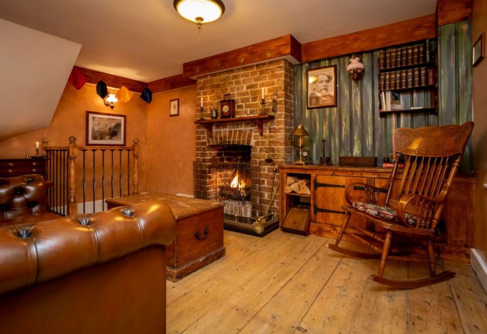 When guests arrive, they will step inside the cottage on the first floor and be welcomed into the lounge where seating surrounds an open fireplace