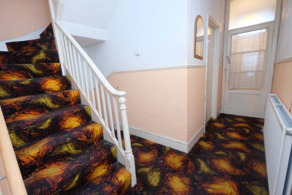 The property's carpets give the home a vibrant, retro feel