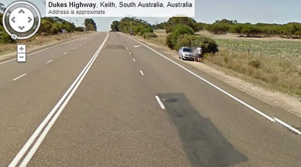 The couple were pictured bending over a silver BMW in Keith, South Australia