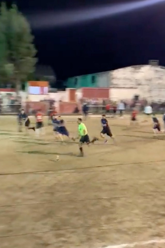 Referee Eduardo Pastorino tried to sprint away from the players of La Puerta following a cup final clash