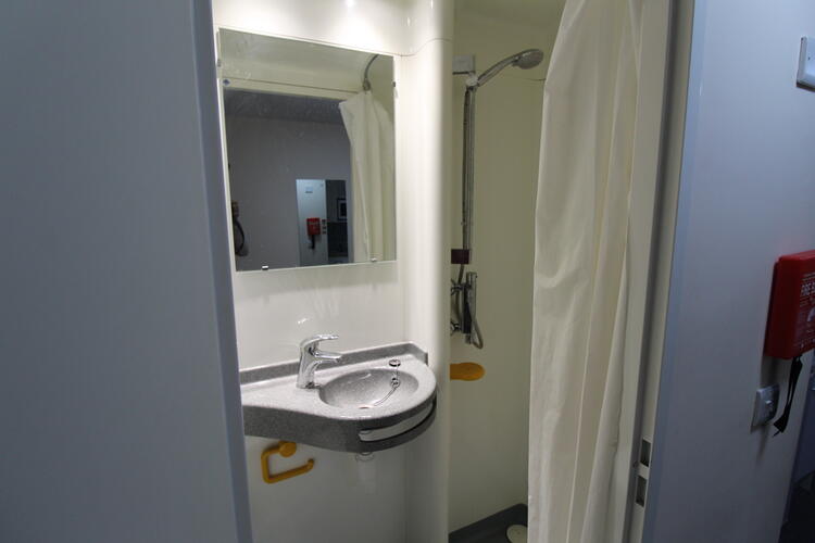 The shower-room is adjoined to the flat but there is not a huge amount of room