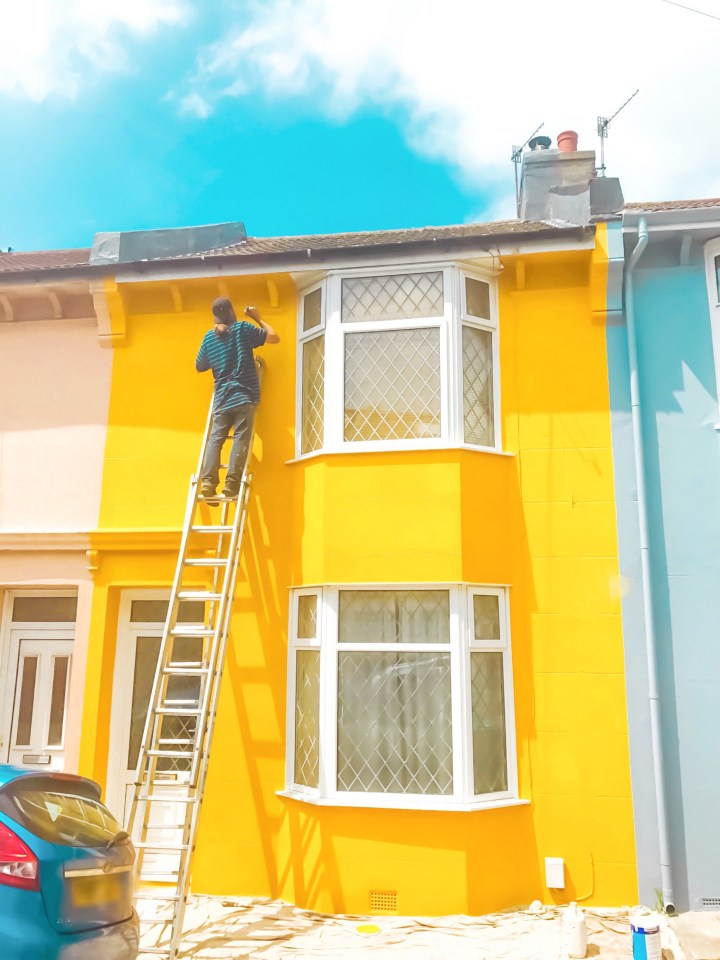 The house was painted a bright yellow to match the tropical marvel inside