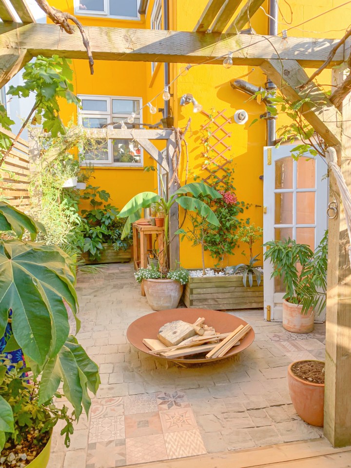 The garden has been transformed into a paradise with new tiles, decking and an outdoor shower