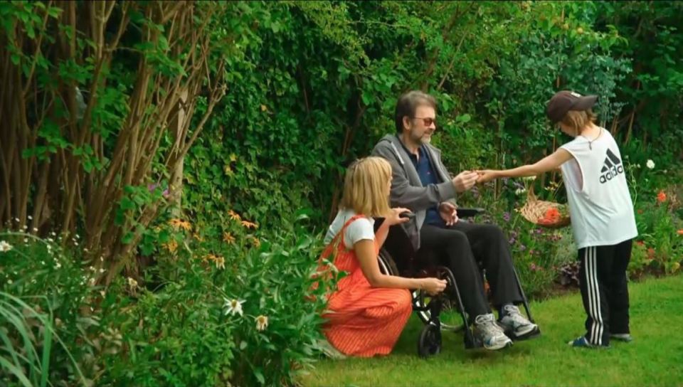 The presenter spends time with Derek and son Billy in their healing garden