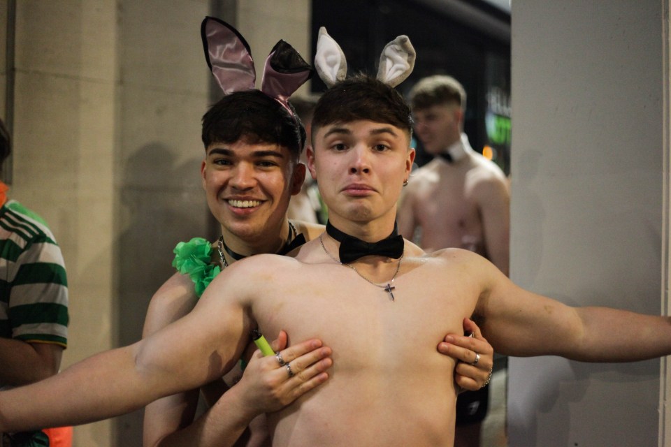 Young men posed for a picture appearing in Playboy-esque attire