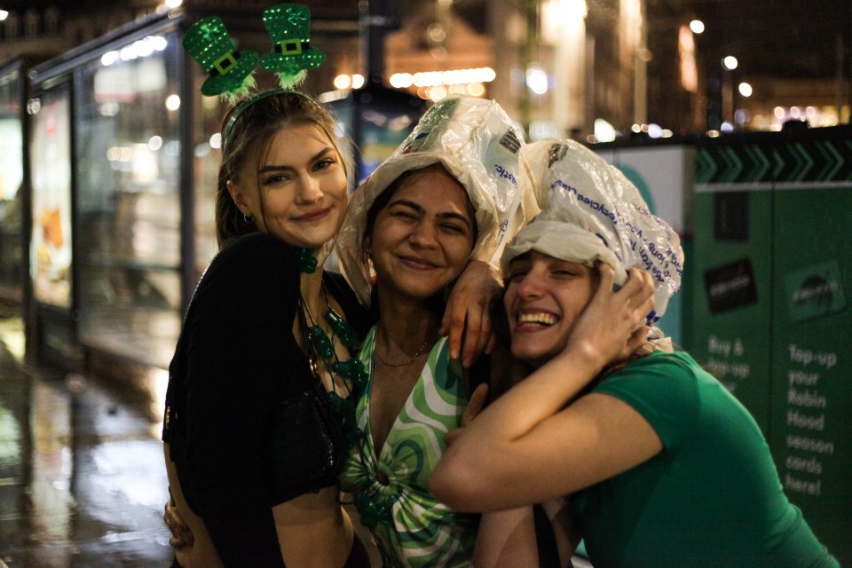 Three friends smiled for a picture as they enjoyed their night out