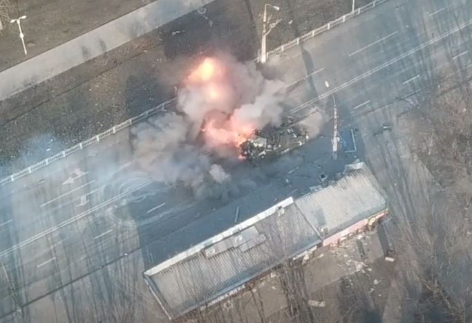 The 40-ton tank is rocked by a series of fireball explosions