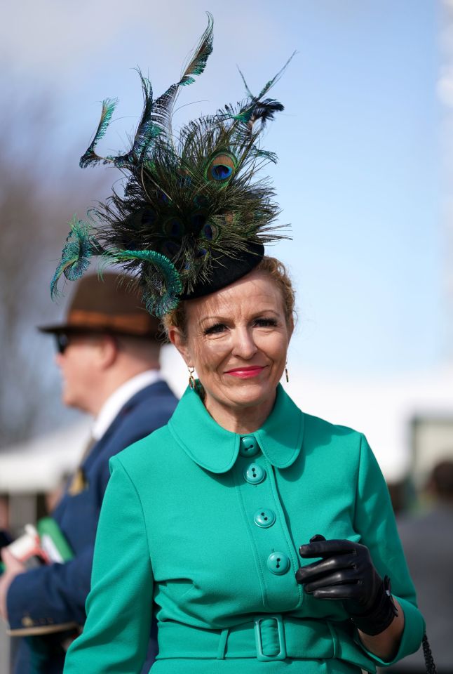 This woman took a classy approach to the green theme, wearing a headpiece adorned with peacock feathers