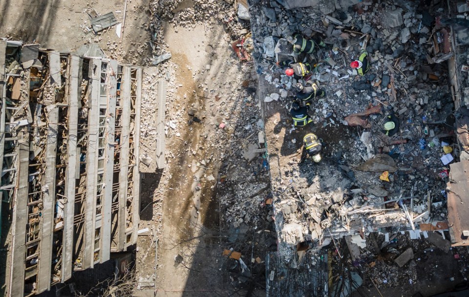 The aftermath of a deadly missile strike on an apartment block in Kyiv today