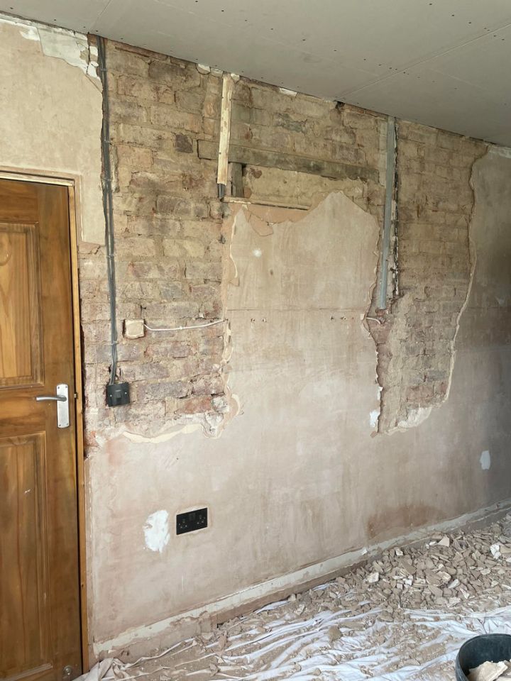 Cheryl completely gutted the room and knocked the main wall back to brick