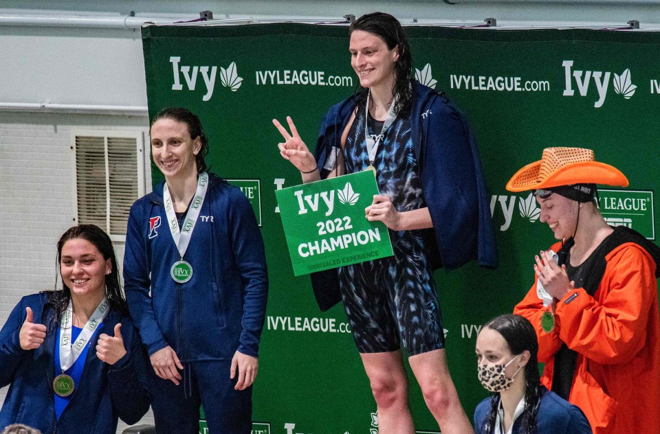 Liaia Thomas celebrates taking first place in the 500 yard freestyle