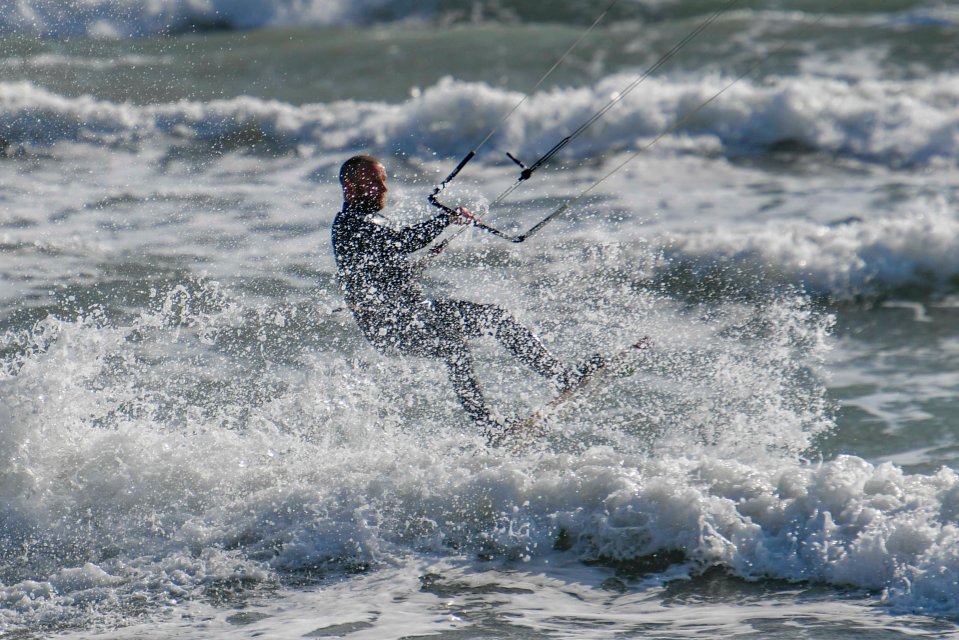 A kite surfer in Weymouth in Dorset on a sunny morning