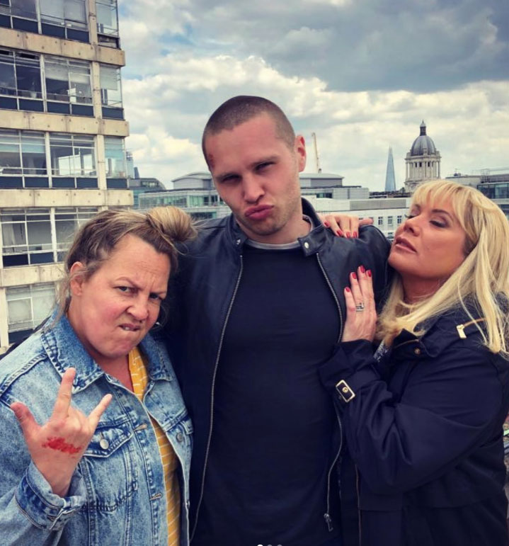 Danny larks about on set with co-stars Lorraine Stanley (left) and Letitia Dean (right)