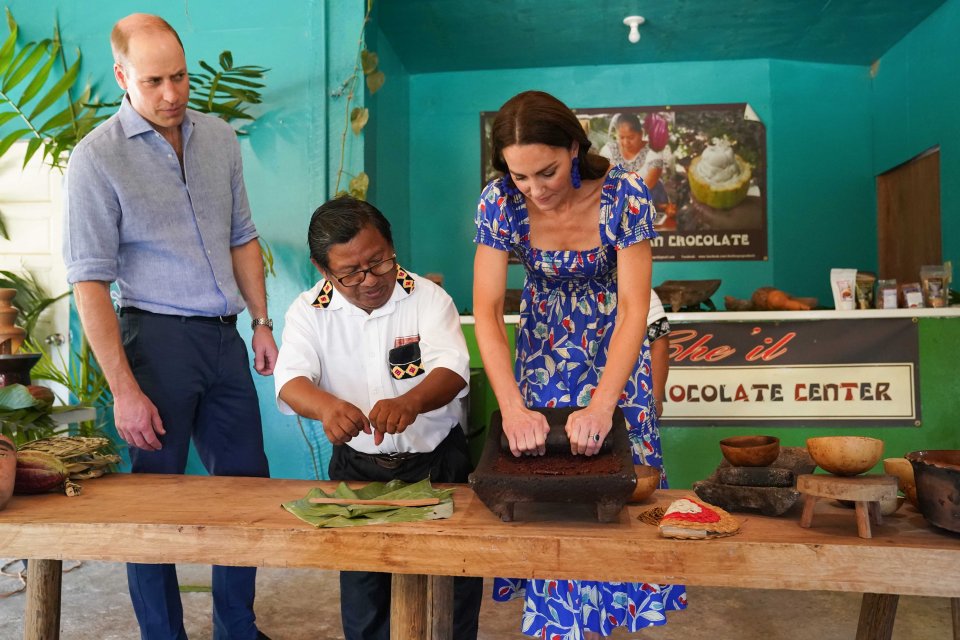 The Duchess tried her hand at crushing some cocoa beans as Wills watched intently