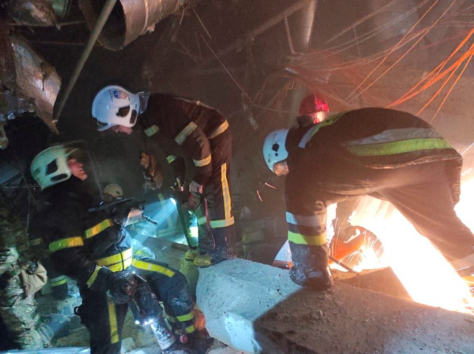 Rescue teams searched for the injured amongst the rubble