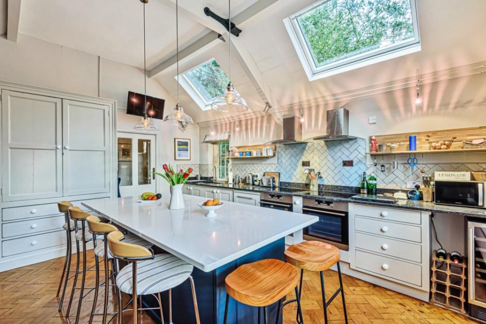 Signs of the building’s former use are everywhere. The modern kitchen is set in the vestry