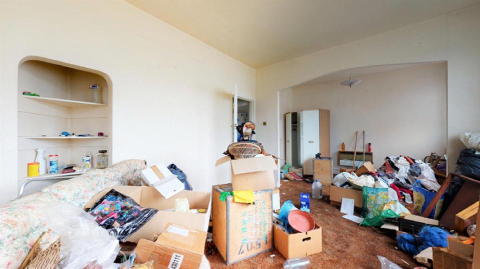 This room has a pile of old clothes chucked in the corner