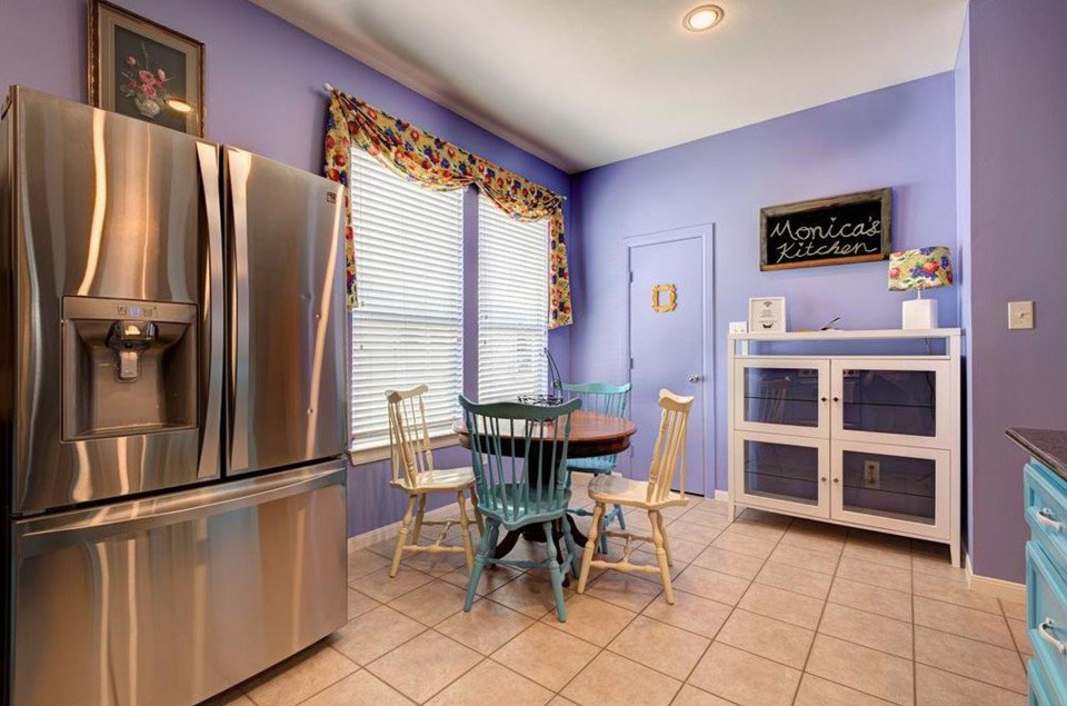 The kitchen has a table and chairs like in Monica and Rachel's apartment