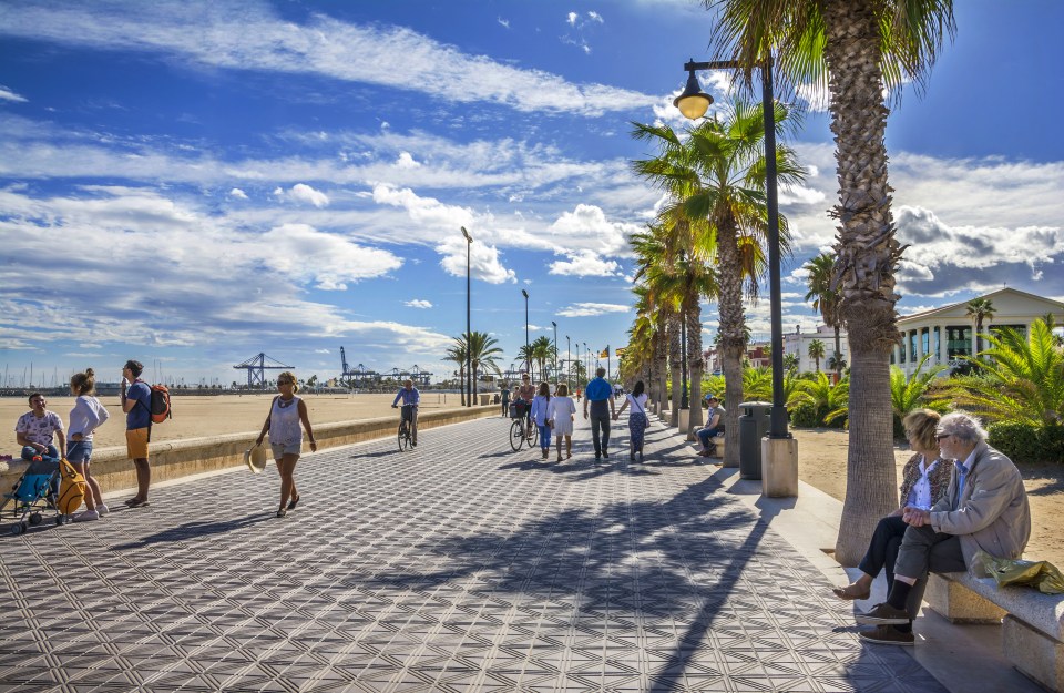 The promenade at Valencia's Malvarossa beach is a hub of activity