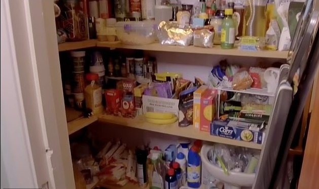 The bathroom and sink was used to store food items and cleaning products