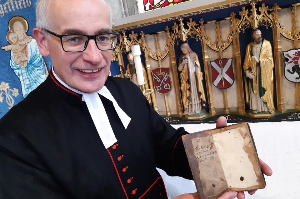 Britain’s longest overdue library book has been returned after 313 years. Pictured Sheffield Cathedral’s Reverend Canon Keith Farrow