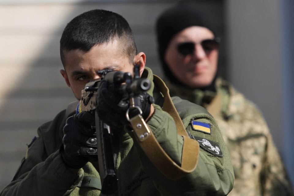 A member of the Ukrainian Territorial Defence Forces takes part in exercises in Kyiv