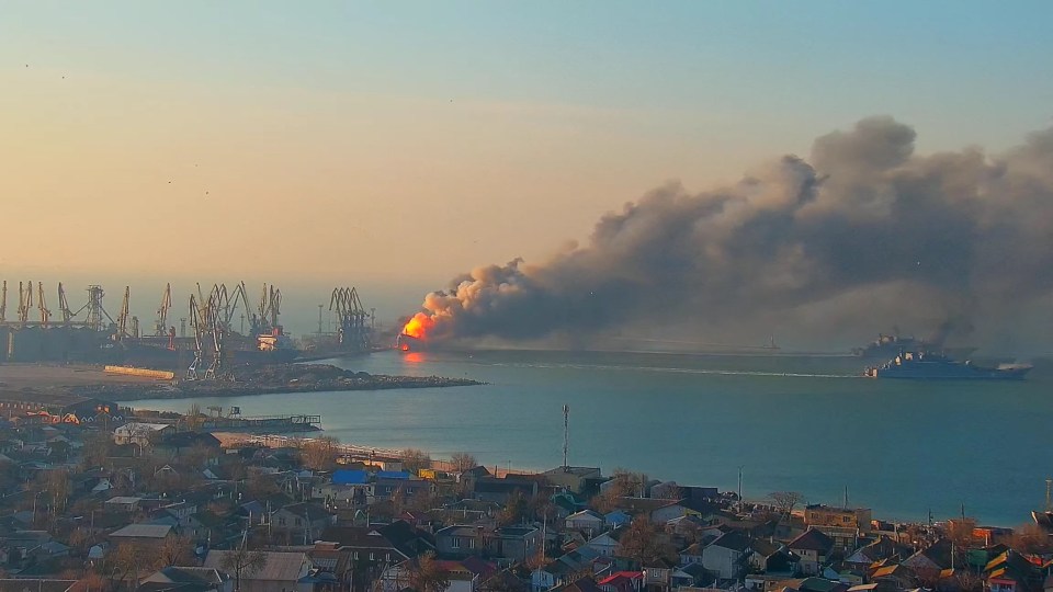 Smoke billows from a fire on a Russian ship at the port of Berdiansk