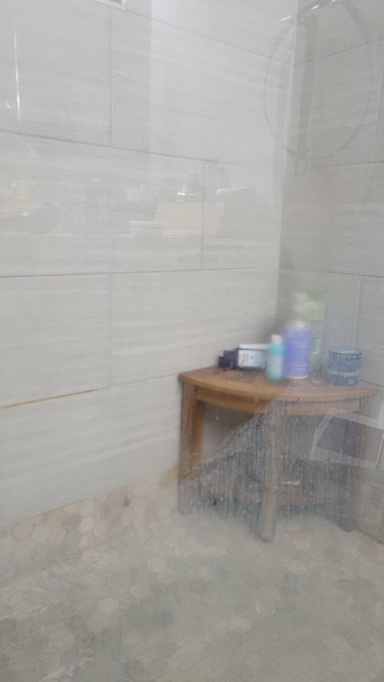 A person on Reddit showed the effect of using WD-40 on their shower to remove hard water marks