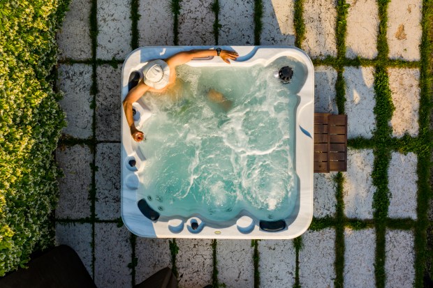 an aerial view of a man in a hot tub