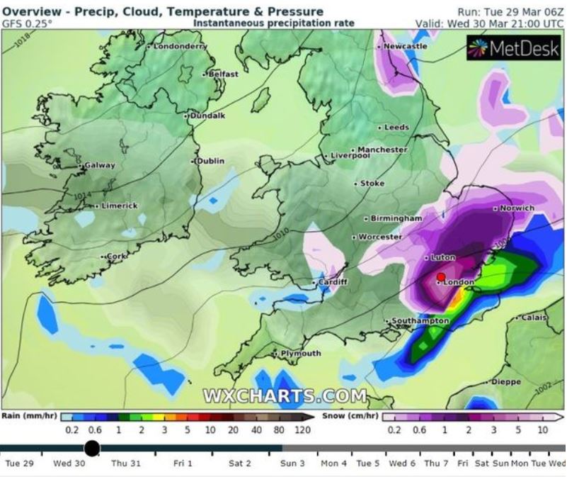 Weather charts show snow (in purple) over London from 9pm on Wednesday