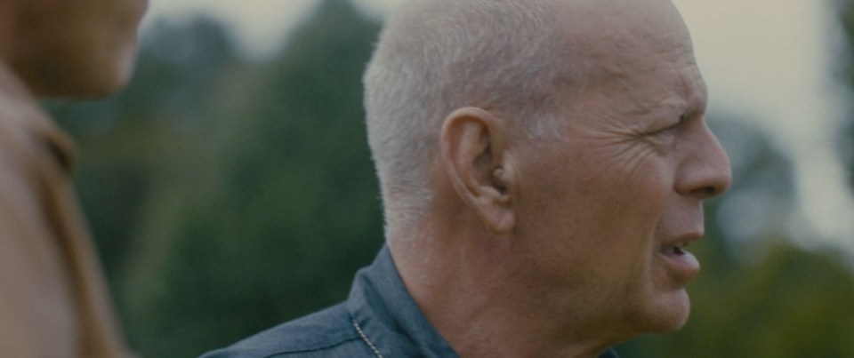 Bruce wore an earpiece while appearing in his more recent movies