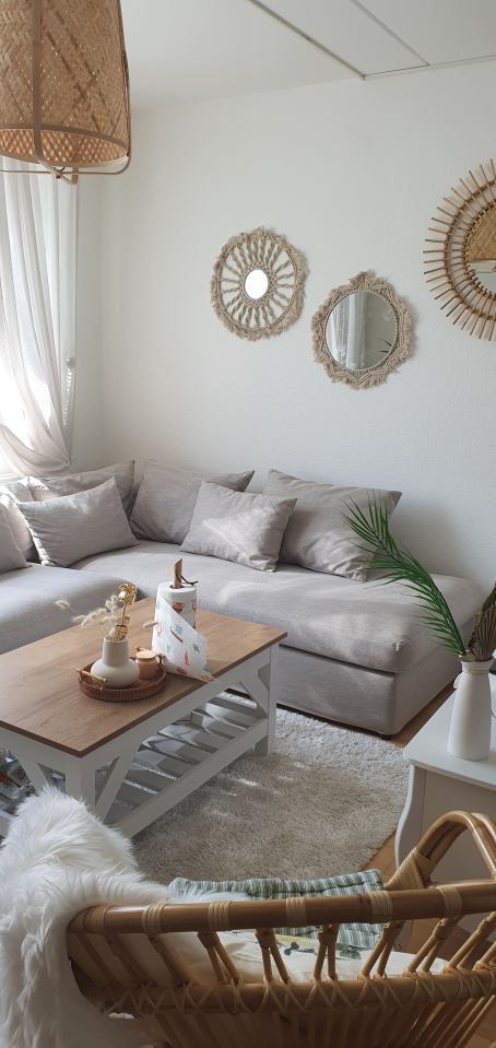 She swapped them for a sleek grey corner sofa, rattan chair and a much more appealing coffee table