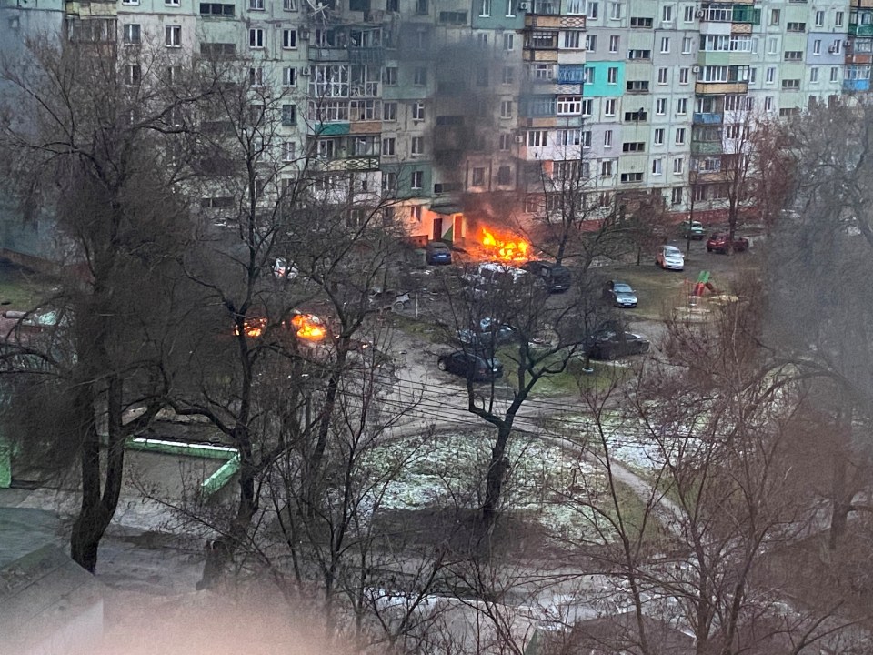 Fire is seen in Mariupol at a residential area after shelling by Russian troops