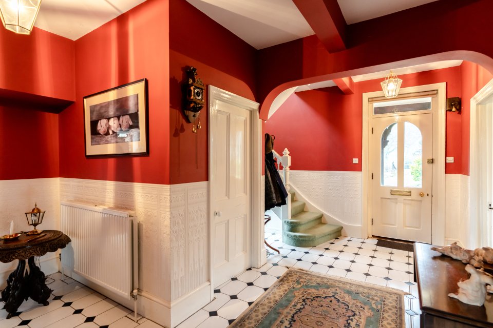 The house includes tiled flooring and a turning staircase