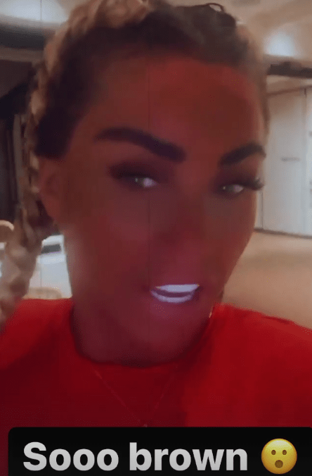 Katie showed fans her tan, claiming she 'couldn't get any browner'