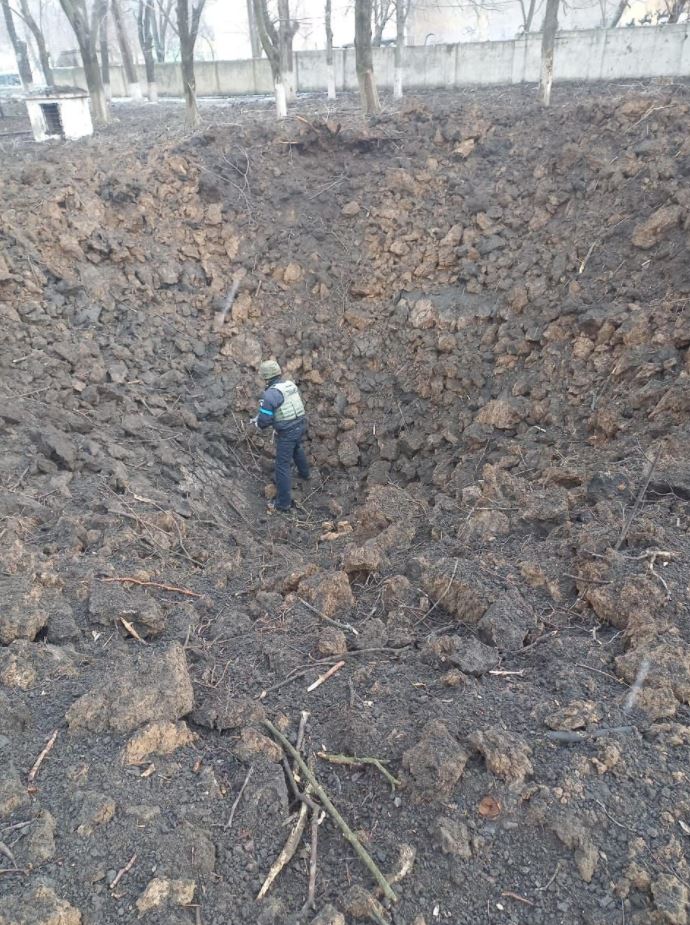 A huge hole in the ground at what appeared to be the grounds of the hospital