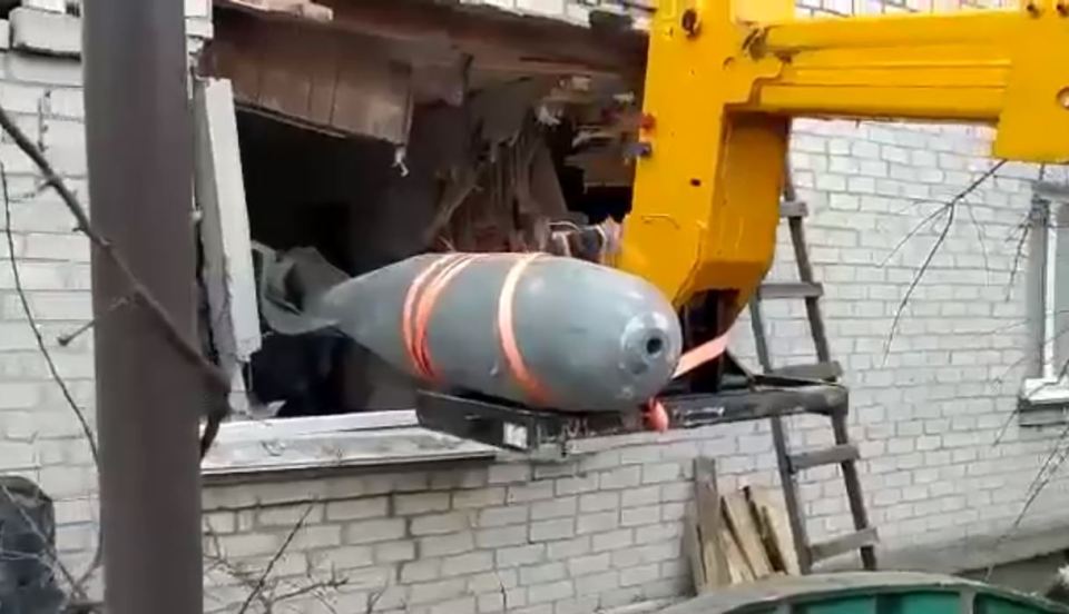 The bomb being carefully removed from the flat