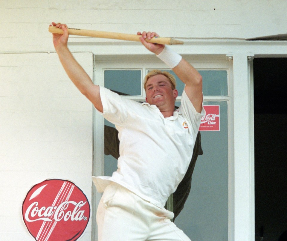 Shane celebrates by dancing with a cricket stump