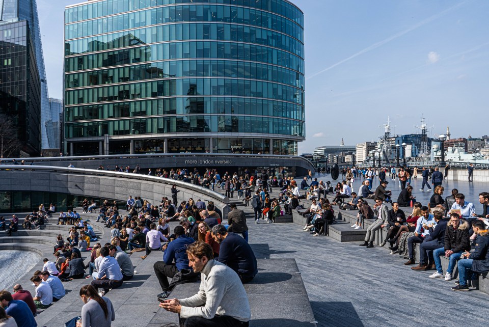 Workers out enjoying the warm spring sunshine at the scoop on London Riverside