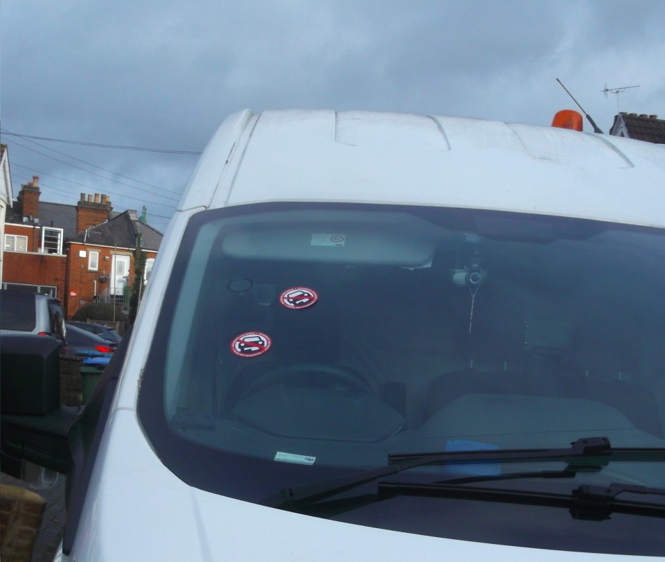 Tony plasters his 'Pavements for People' stickers on vehicles around Shirley, Southampton