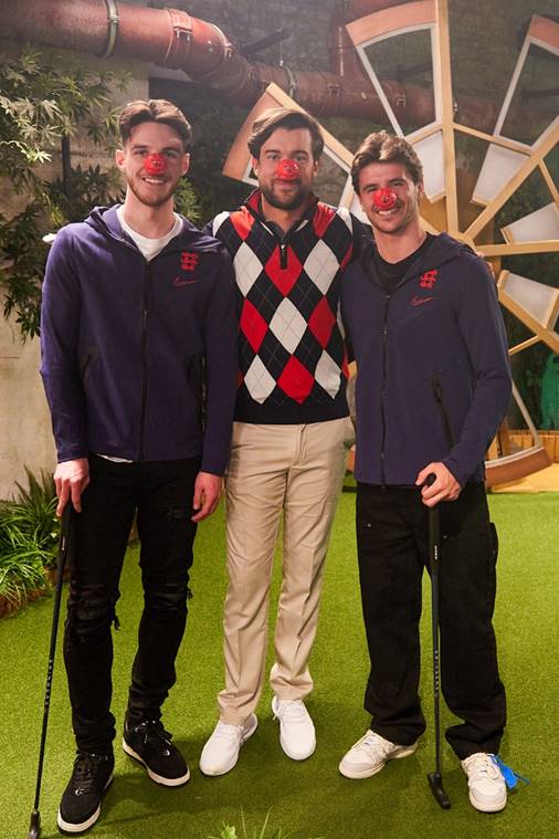 Jack Whitehall proudly poses with footballers Mason Mount and Declan Rice