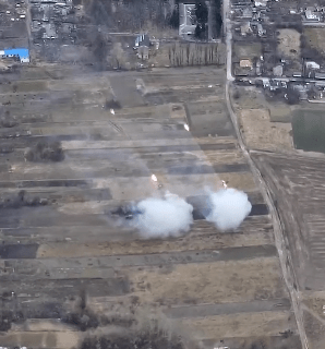 Rocket launchers firing near Peremoha some 40 miles from the capital- appearing to be firing towards Kyiv