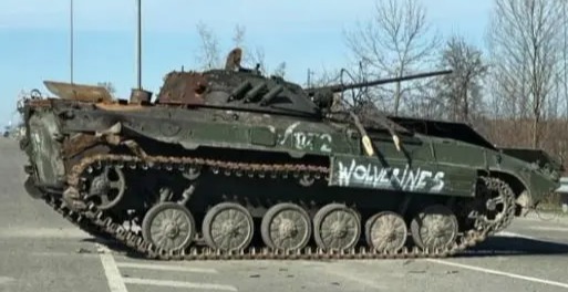 The word 'Wolverine' has been scrawled on destroyed Russian tanks