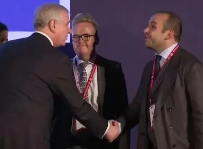 The Duke of York shaking hands with Selman Turk