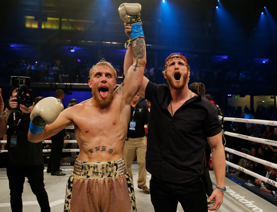 Jake Paul celebrates with his brother Logan after a win in 2020