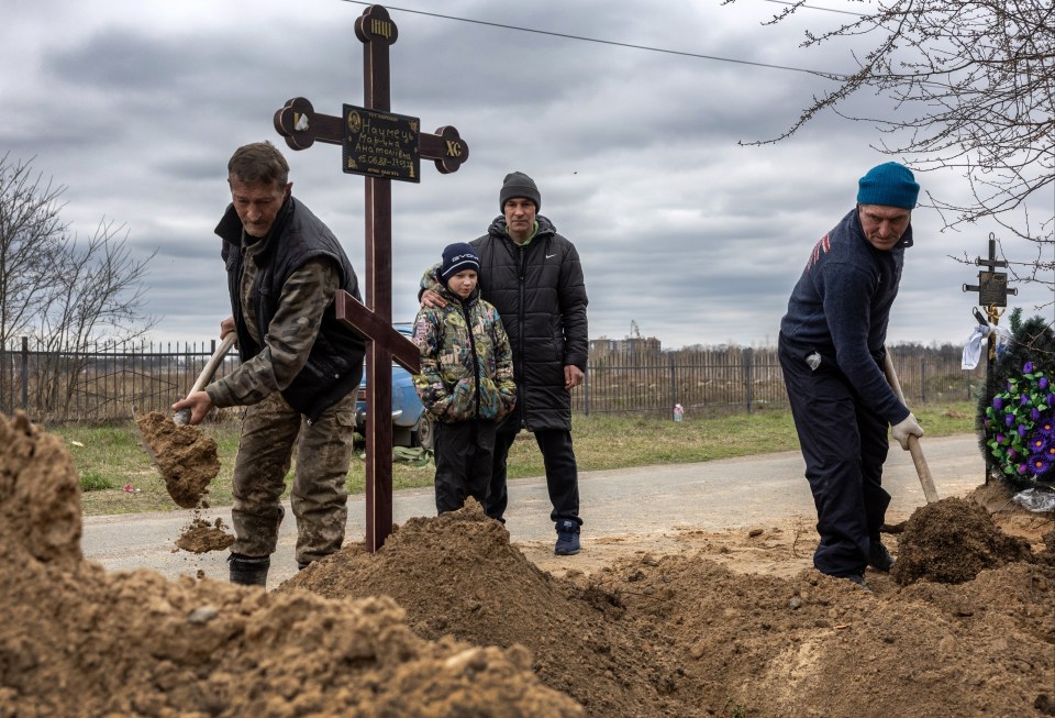 The town is still burying its dead following the discovery of mass graves dug by the Russians