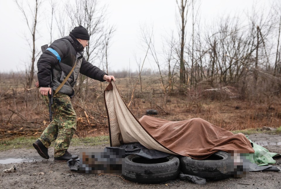 Four dead civilians were found under a blanket by the side of the road