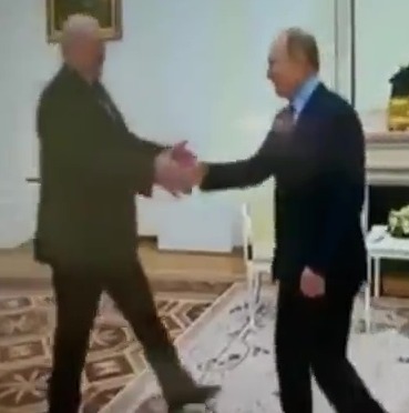 Putin desperately masks his shakes by embracing Belarusian President Alexander Lukashenko during a meeting at the Kremlin