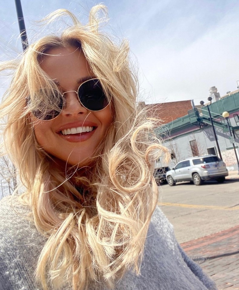 Emily Atack flashed a big smile as she arrived in Colorado to film her new travel series