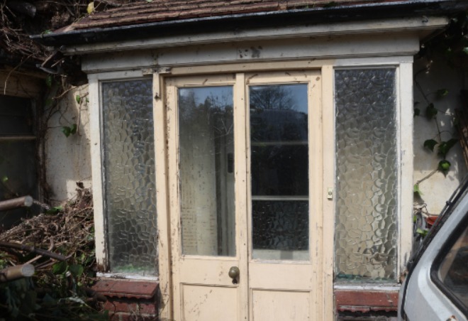 The porch now has pride of place after being hidden by greenery for years